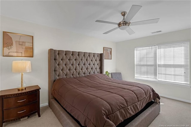 bedroom with light carpet and ceiling fan