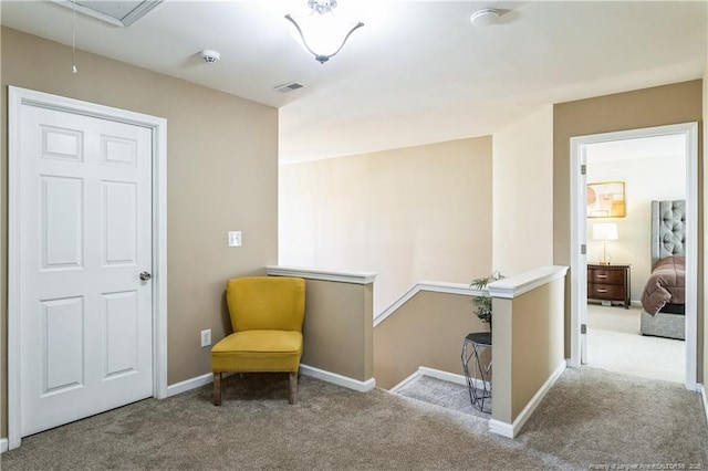 living area featuring light colored carpet