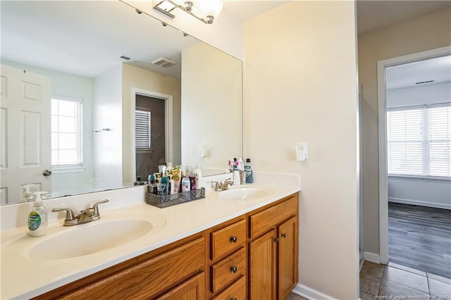 bathroom with vanity and tile patterned floors