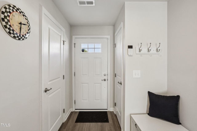 doorway to outside featuring dark hardwood / wood-style flooring