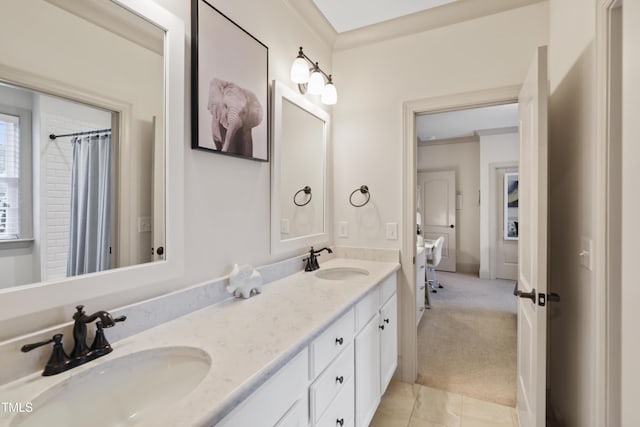 bathroom with crown molding and vanity