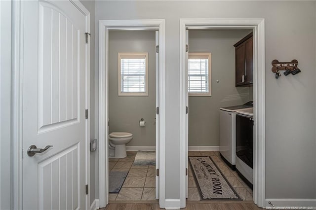 bathroom featuring washer and dryer