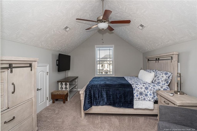 carpeted bedroom with ceiling fan, vaulted ceiling, and a textured ceiling