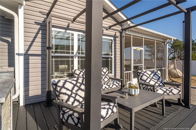 wooden deck with a sunroom