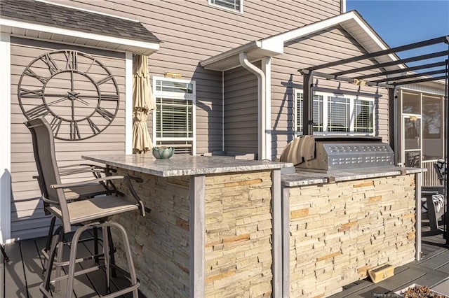 view of patio / terrace with area for grilling and exterior bar