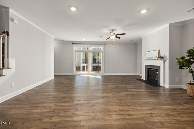 unfurnished living room with a fireplace with flush hearth, dark wood-type flooring, and ornamental molding