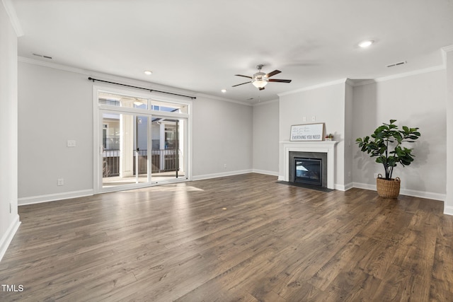 unfurnished living room with baseboards, dark wood-style flooring, a fireplace with flush hearth, and crown molding