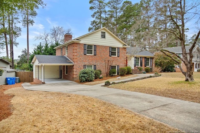 view of front of home with a carport and a front lawn