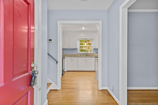 interior space with sink and light hardwood / wood-style flooring