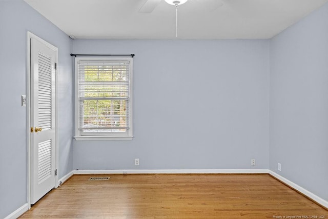 spare room featuring ceiling fan and light wood-type flooring