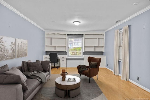 living room featuring ornamental molding and light hardwood / wood-style floors