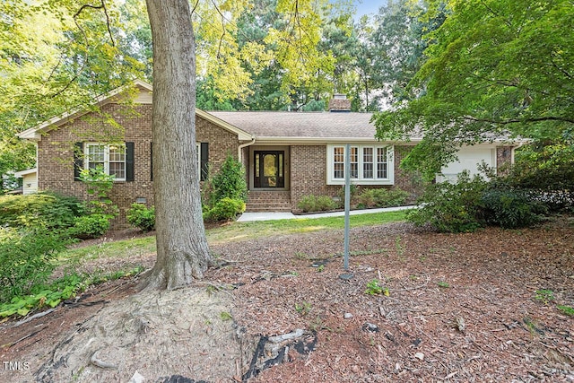 single story home featuring a garage