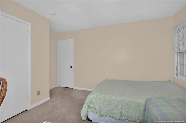 bedroom with light colored carpet