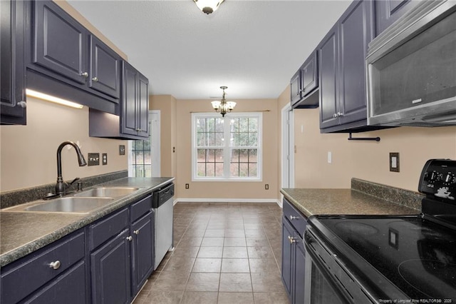 kitchen with tile patterned flooring, sink, a chandelier, and appliances with stainless steel finishes