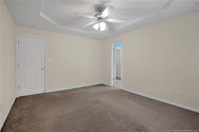 empty room featuring carpet floors and ceiling fan