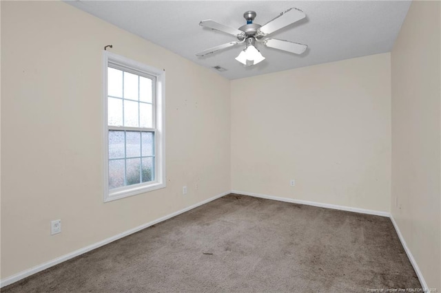 empty room with carpet floors and ceiling fan