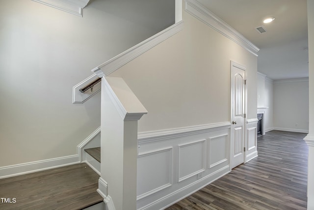 interior space with hardwood / wood-style flooring and ornamental molding