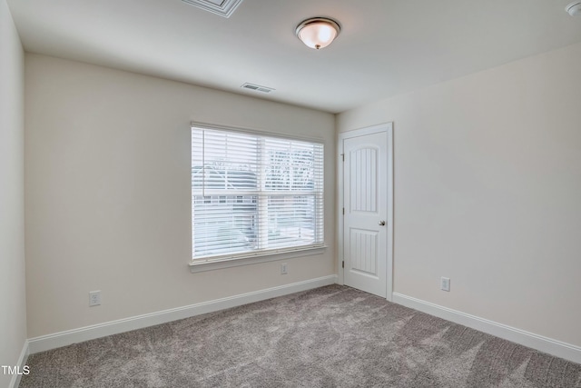 view of carpeted spare room