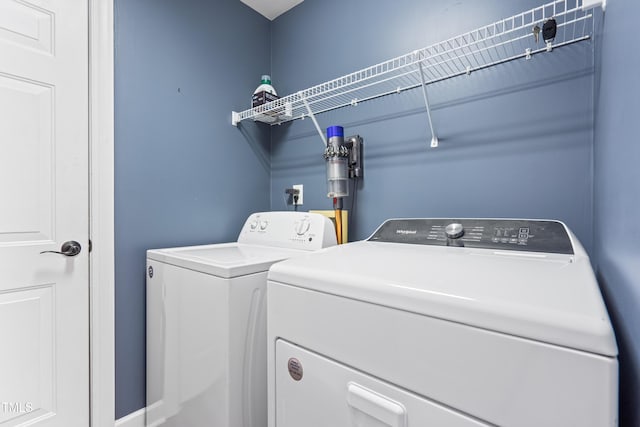 laundry room with laundry area and washing machine and clothes dryer