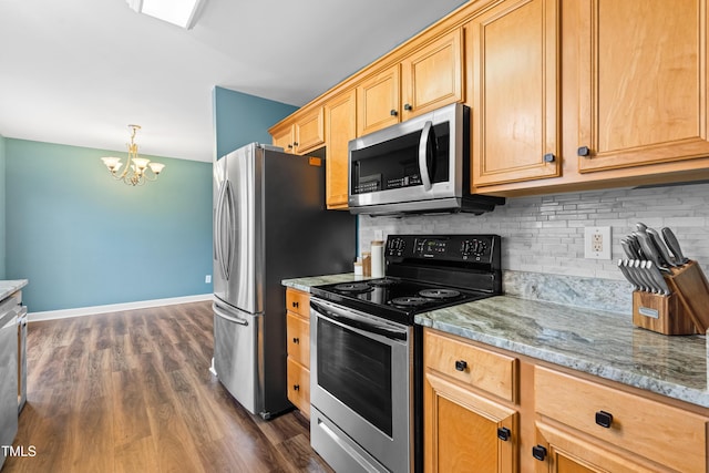 kitchen featuring baseboards, appliances with stainless steel finishes, light stone countertops, tasteful backsplash, and dark wood finished floors