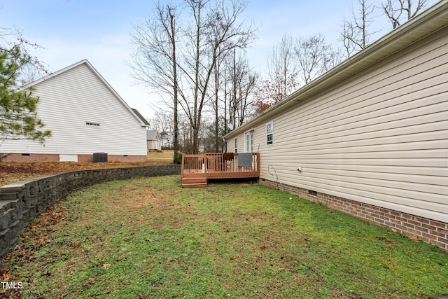 view of yard with a deck and cooling unit