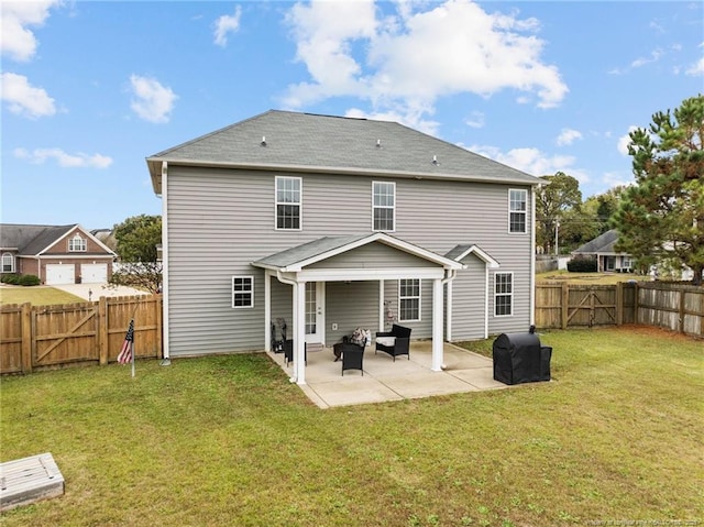 back of house with a patio and a lawn