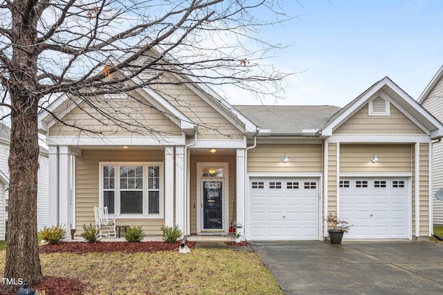 view of front of house featuring an attached garage and driveway