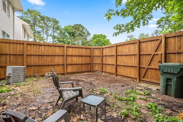 fenced backyard with cooling unit