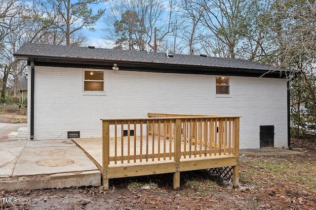 rear view of house with a wooden deck