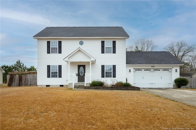 colonial home featuring a garage and a front lawn