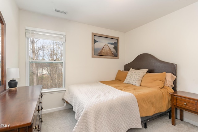 bedroom featuring carpet, visible vents, and baseboards