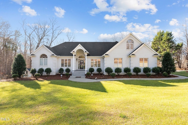 ranch-style house featuring a front lawn