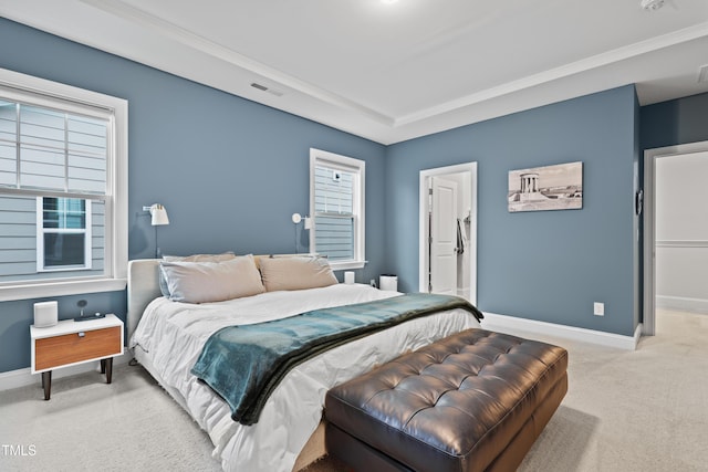 carpeted bedroom with ornamental molding