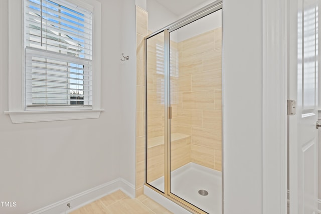 bathroom with a shower with shower door