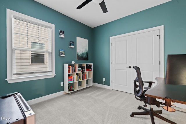 office space with light colored carpet and ceiling fan