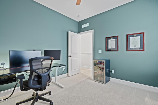 office area with light carpet and ceiling fan