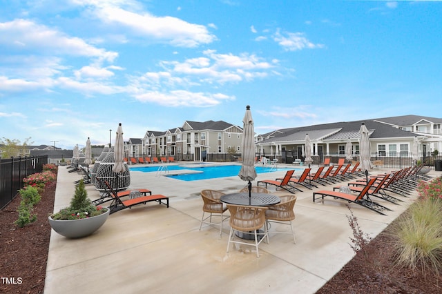 view of swimming pool featuring a patio area