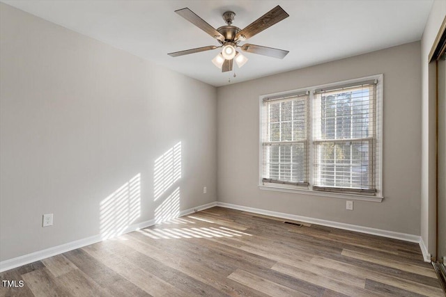 unfurnished room featuring wood-type flooring and ceiling fan