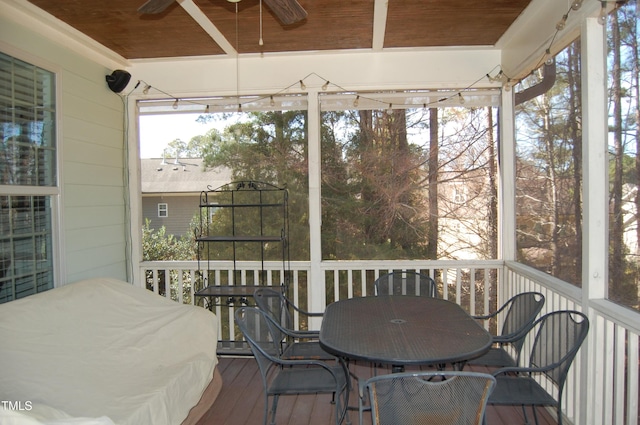 sunroom / solarium with wooden ceiling and ceiling fan