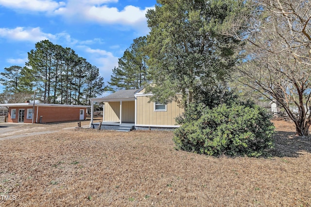 back of property featuring entry steps