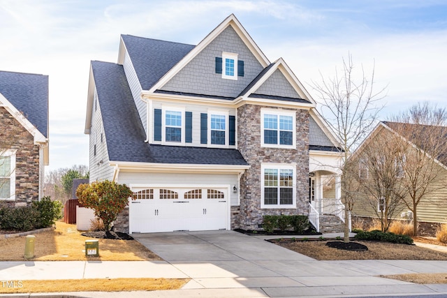 craftsman house featuring a garage, concrete driveway, a shingled roof, and stone siding