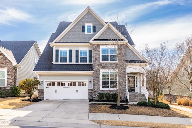 craftsman inspired home featuring a garage, stone siding, roof with shingles, and driveway