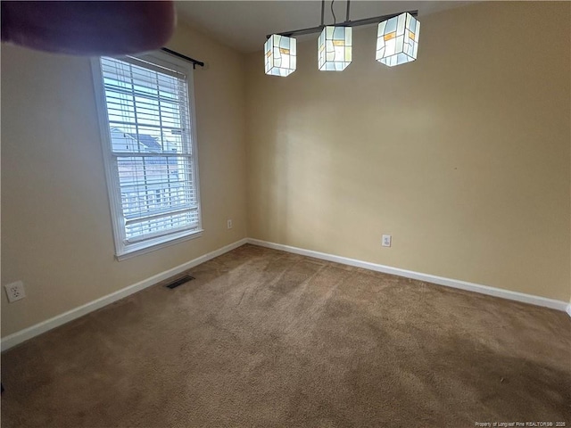 unfurnished dining area with carpet floors