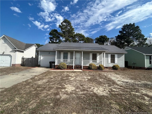 single story home featuring a porch and a garage