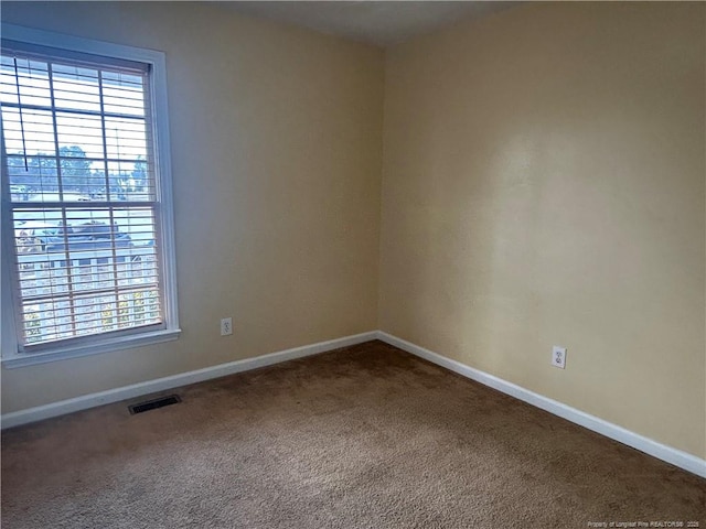 view of carpeted spare room