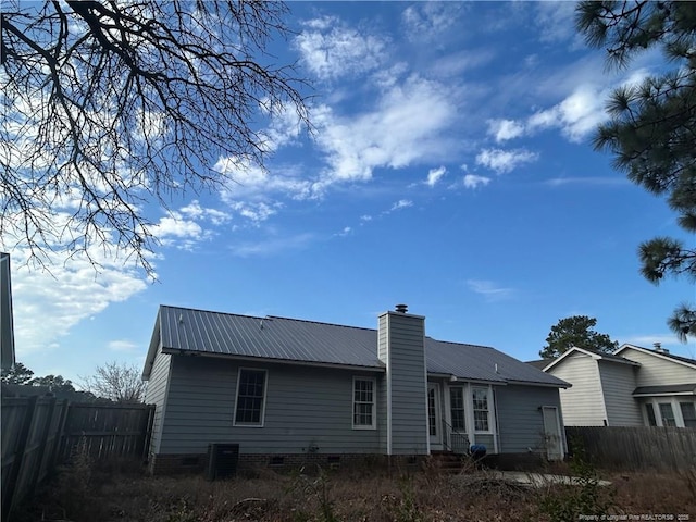 rear view of property featuring central air condition unit