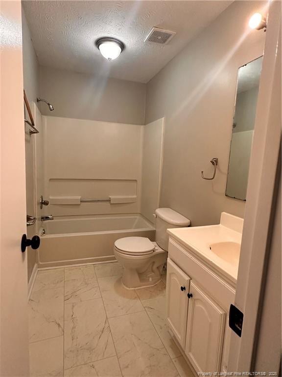 full bathroom featuring vanity,  shower combination, toilet, and a textured ceiling