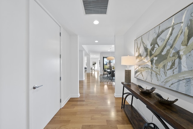 hallway with light wood-type flooring