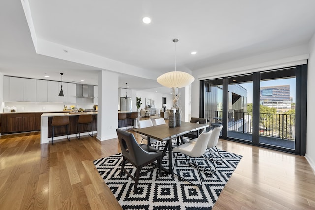 dining area with light wood-type flooring