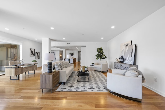 living room with light hardwood / wood-style flooring